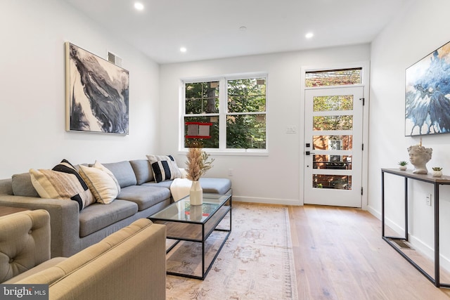 living room with light hardwood / wood-style floors