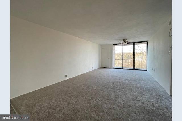 spare room featuring carpet flooring and ceiling fan