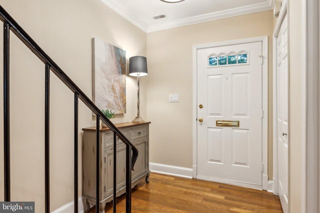 entryway featuring stairs, light wood finished floors, baseboards, and crown molding