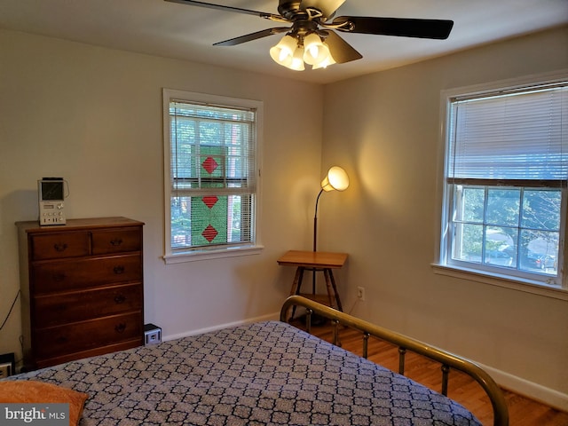 bedroom featuring ceiling fan and wood-type flooring