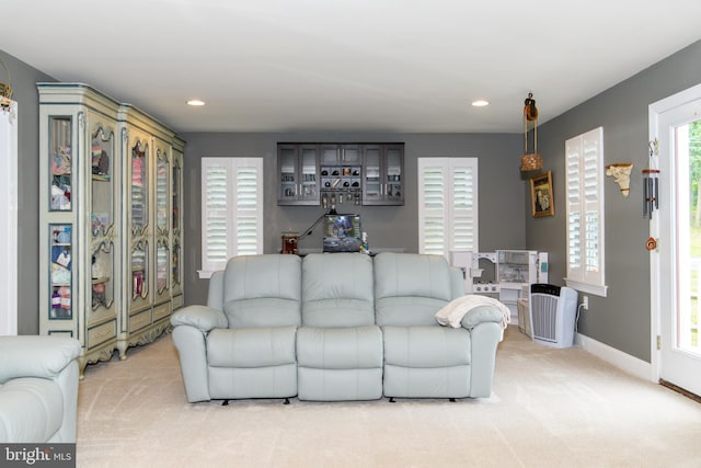 living room featuring light carpet