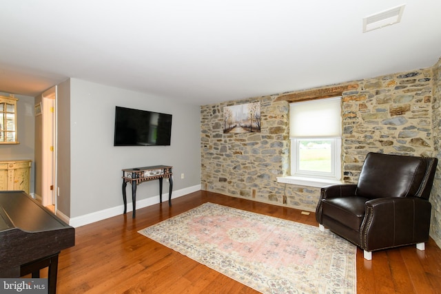 sitting room with hardwood / wood-style floors