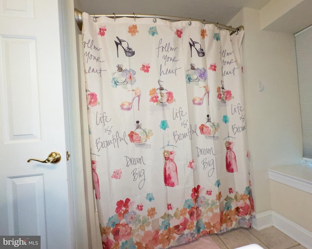 bathroom with tile patterned flooring