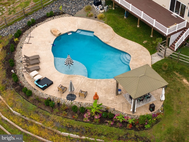 view of swimming pool featuring a gazebo and a lawn