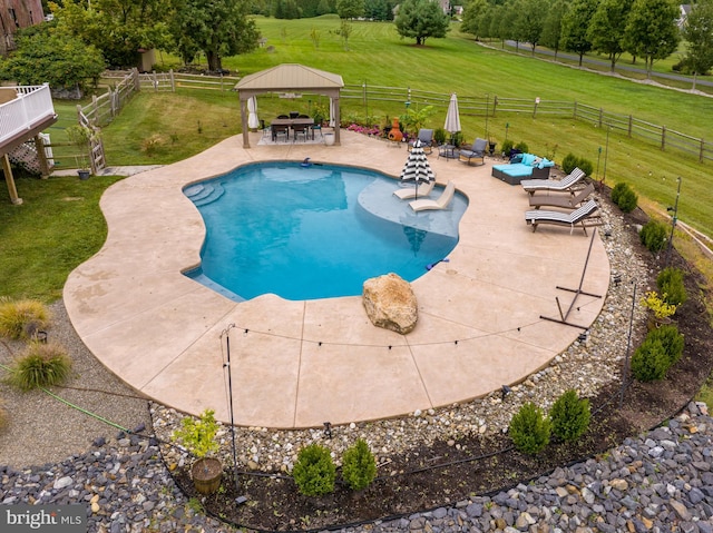 view of pool featuring a gazebo, a yard, and a patio