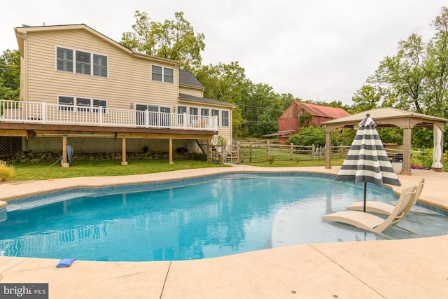 view of pool featuring a gazebo and a deck