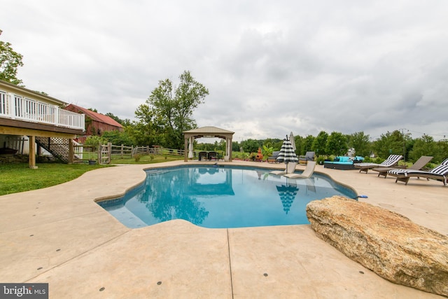 view of swimming pool featuring a gazebo and a patio