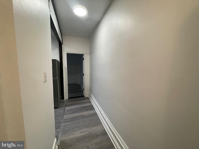 corridor with dark wood-type flooring