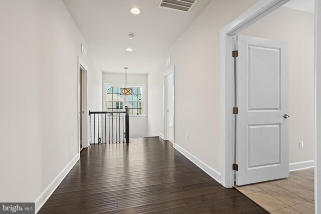 corridor with wood-type flooring