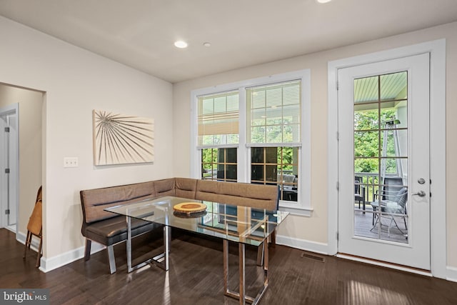 dining room featuring dark hardwood / wood-style floors and breakfast area