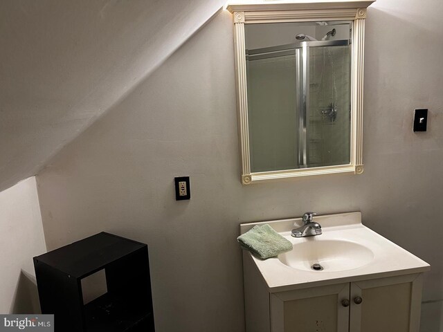 bathroom with vanity and an enclosed shower