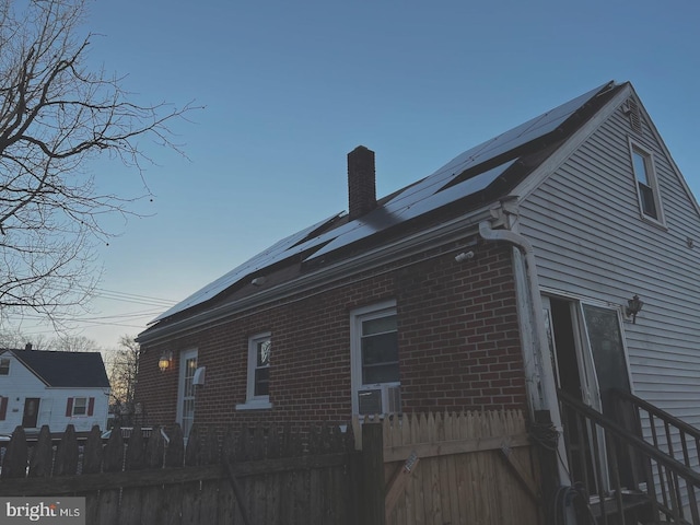 view of home's exterior with solar panels