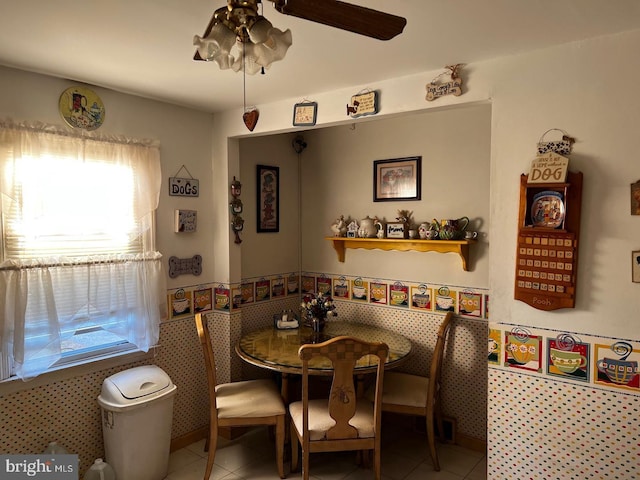 dining area featuring tile patterned flooring, a healthy amount of sunlight, and ceiling fan