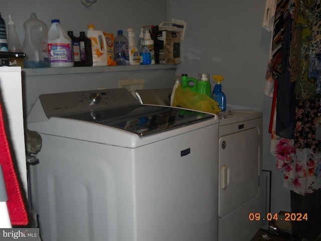 clothes washing area featuring independent washer and dryer