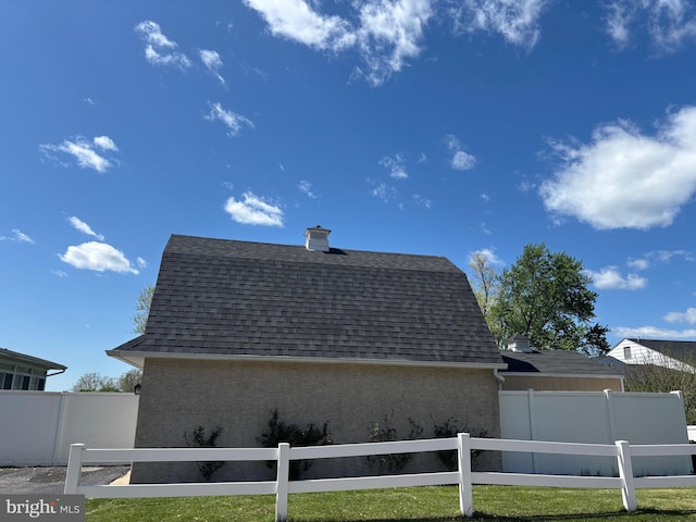 451 Ridge Pike, Lafayette Hill, PA 19444 - view of property exterior with a shingled roof and a chimney