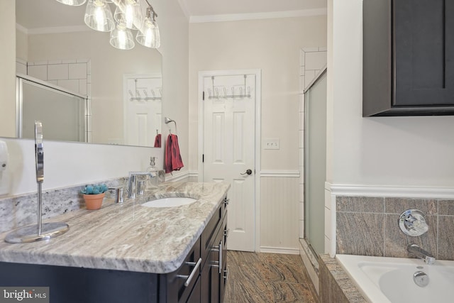 bathroom with vanity, separate shower and tub, and ornamental molding