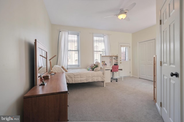 carpeted bedroom with ceiling fan