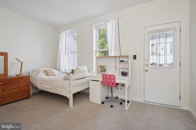 bedroom featuring light colored carpet