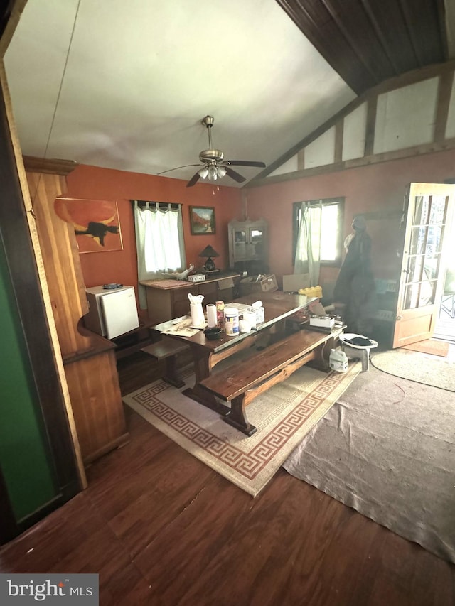 miscellaneous room with dark wood-type flooring, ceiling fan, and vaulted ceiling with beams