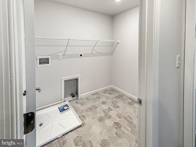 laundry area featuring baseboards, hookup for an electric dryer, hookup for a washing machine, and laundry area