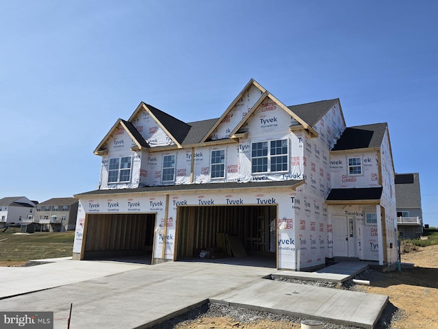 unfinished property featuring a garage