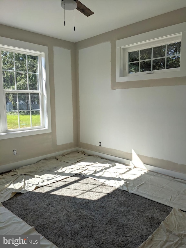 unfurnished room with ceiling fan