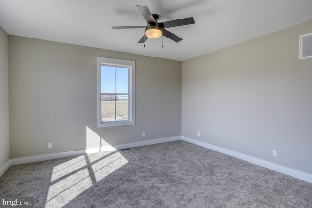 empty room with a ceiling fan, baseboards, and carpet floors