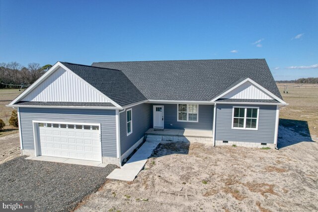 view of front facade featuring crawl space, a garage, and roof with shingles