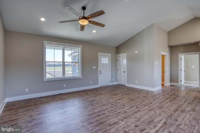 unfurnished living room featuring baseboards, recessed lighting, wood finished floors, high vaulted ceiling, and a ceiling fan