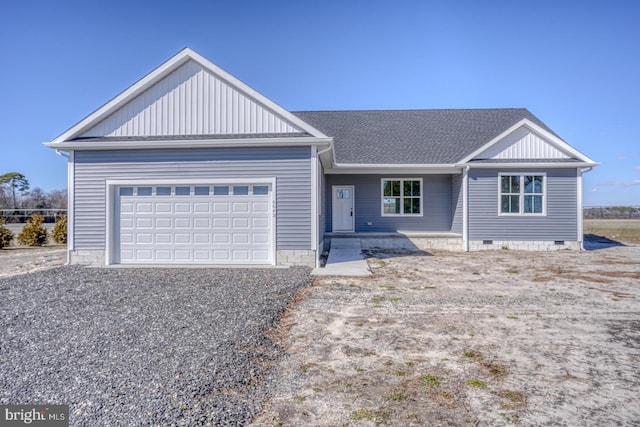 ranch-style home with crawl space, a shingled roof, gravel driveway, and a garage