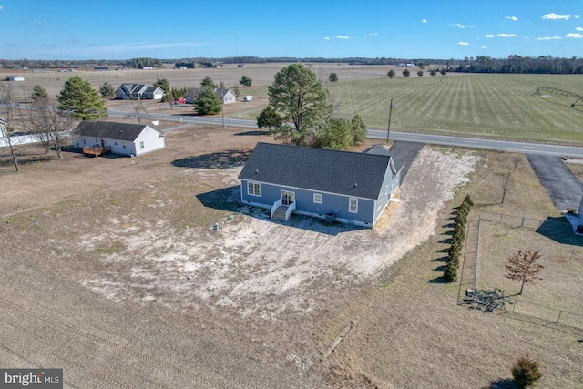 birds eye view of property with a rural view