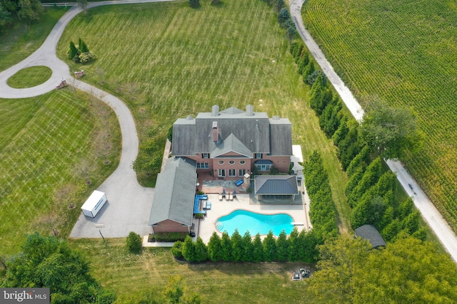 birds eye view of property with a rural view