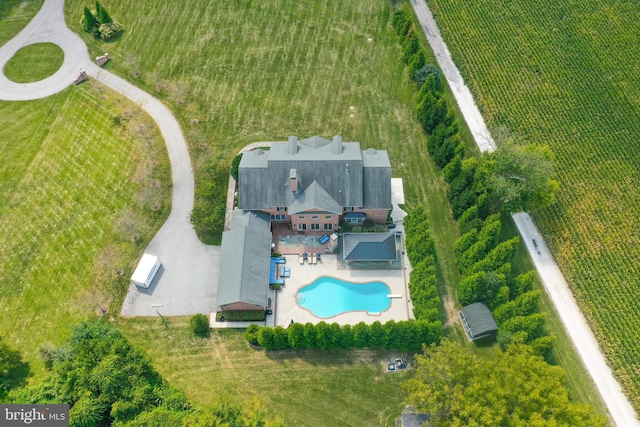 birds eye view of property with a rural view