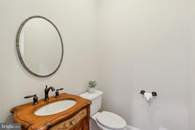 bathroom with toilet and vanity