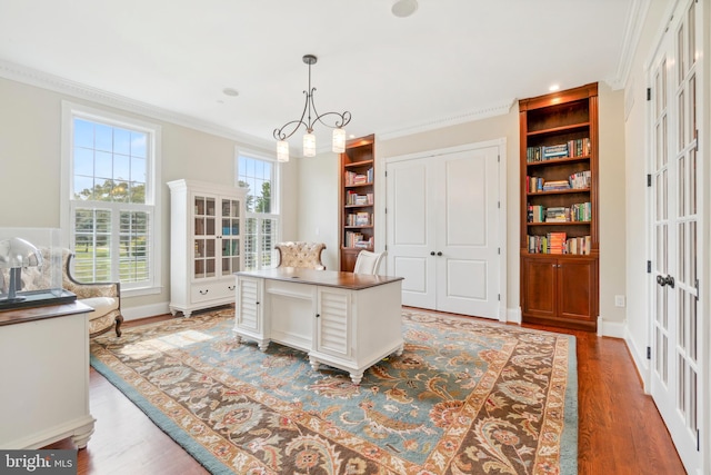 home office with french doors, hardwood / wood-style flooring, a chandelier, and ornamental molding