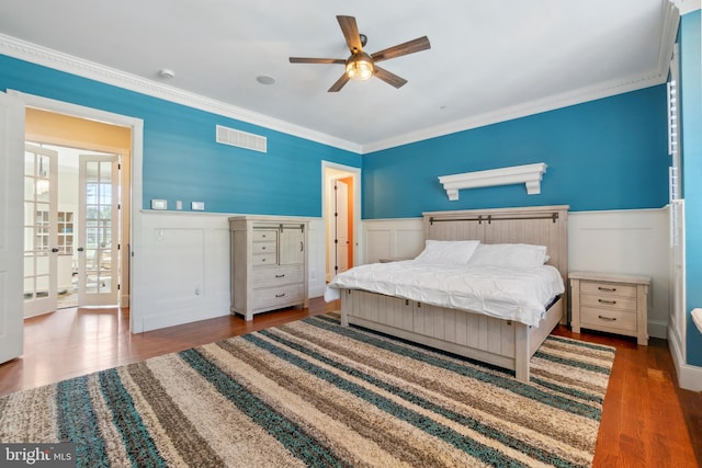 bedroom with french doors, ceiling fan, hardwood / wood-style flooring, and ornamental molding