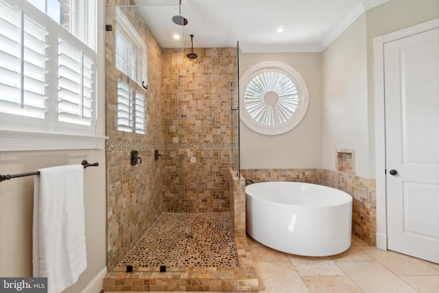 bathroom featuring shower with separate bathtub, ornamental molding, and tile patterned floors