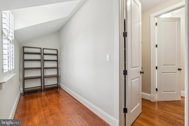 interior space with lofted ceiling and hardwood / wood-style floors