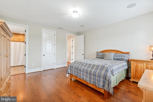 bedroom featuring dark wood-type flooring