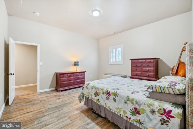 bedroom with light hardwood / wood-style floors