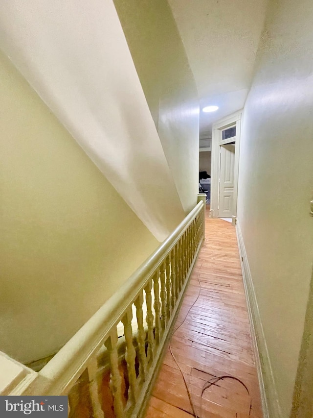 staircase featuring hardwood / wood-style floors