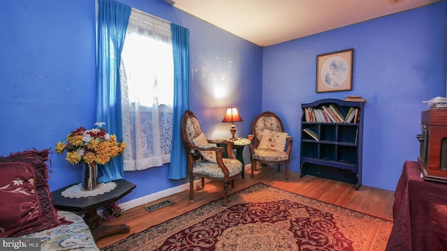 living area with wood-type flooring