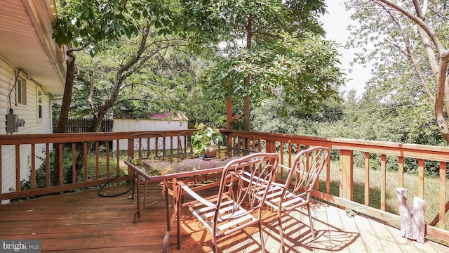 wooden deck with a storage shed