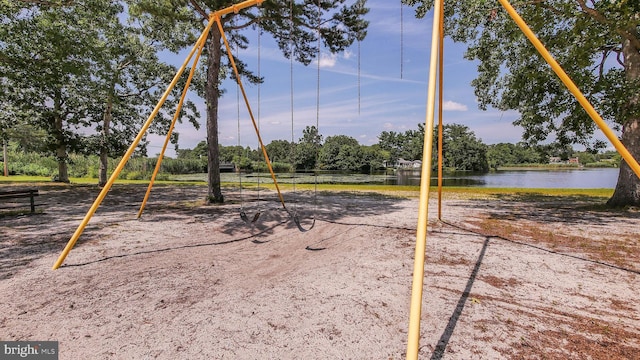 view of play area with a water view