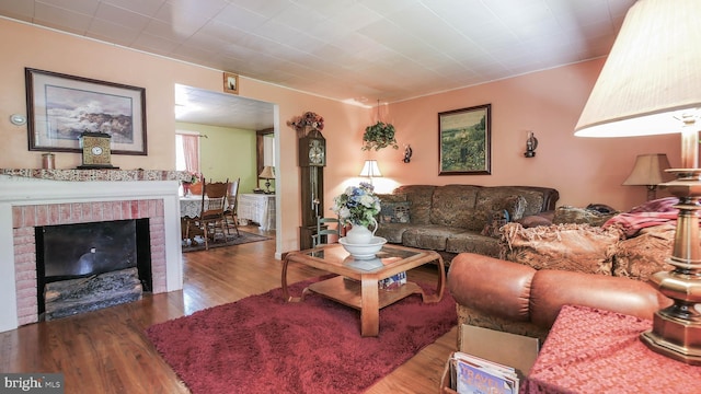 living room featuring hardwood / wood-style floors and a fireplace