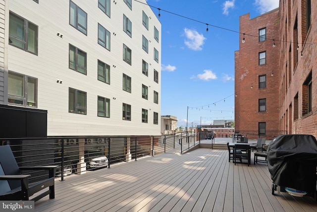 wooden deck with grilling area