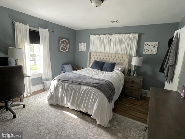 bedroom with light wood-type flooring