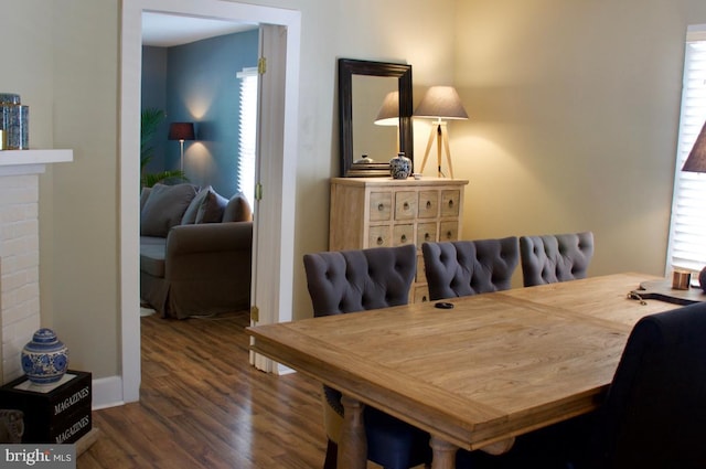 dining area with wood finished floors