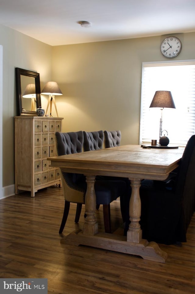 dining space with dark wood-style floors