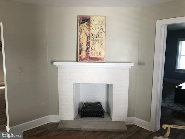 room details featuring wood-type flooring and a fireplace